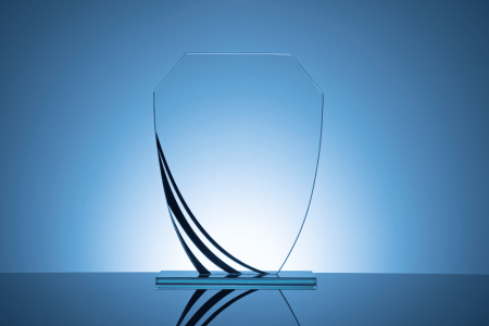 elegant-blank-glass-shield-trophy-on-dark-blue-2023-11-27-05-34-56-utc