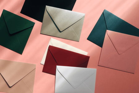 multicolored-envelopes-on-a-pink-background-2023-11-27-05-13-09-utc