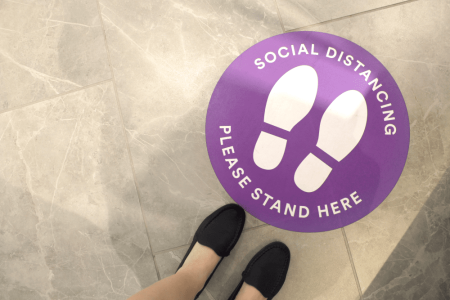 purple-social-distancing-sign-on-the-floor-2023-11-27-05-08-44-utc