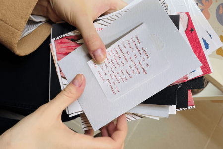 the-girl-chooses-postcards-as-a-gift-2023-11-27-05-24-52-utc